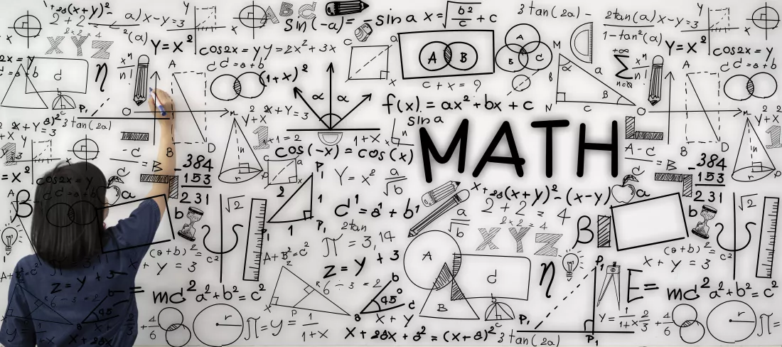 young-female-teacher-is-writing-math-formulas-equations-whiteboard-explain-educational-material-task-her-pupils-students